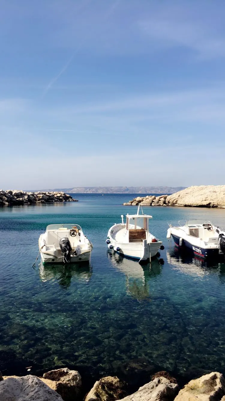 Fishing boats in clear water near Les Goudes