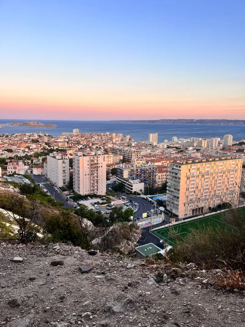 Evening view over the rooftops of Marseille towards the sea
