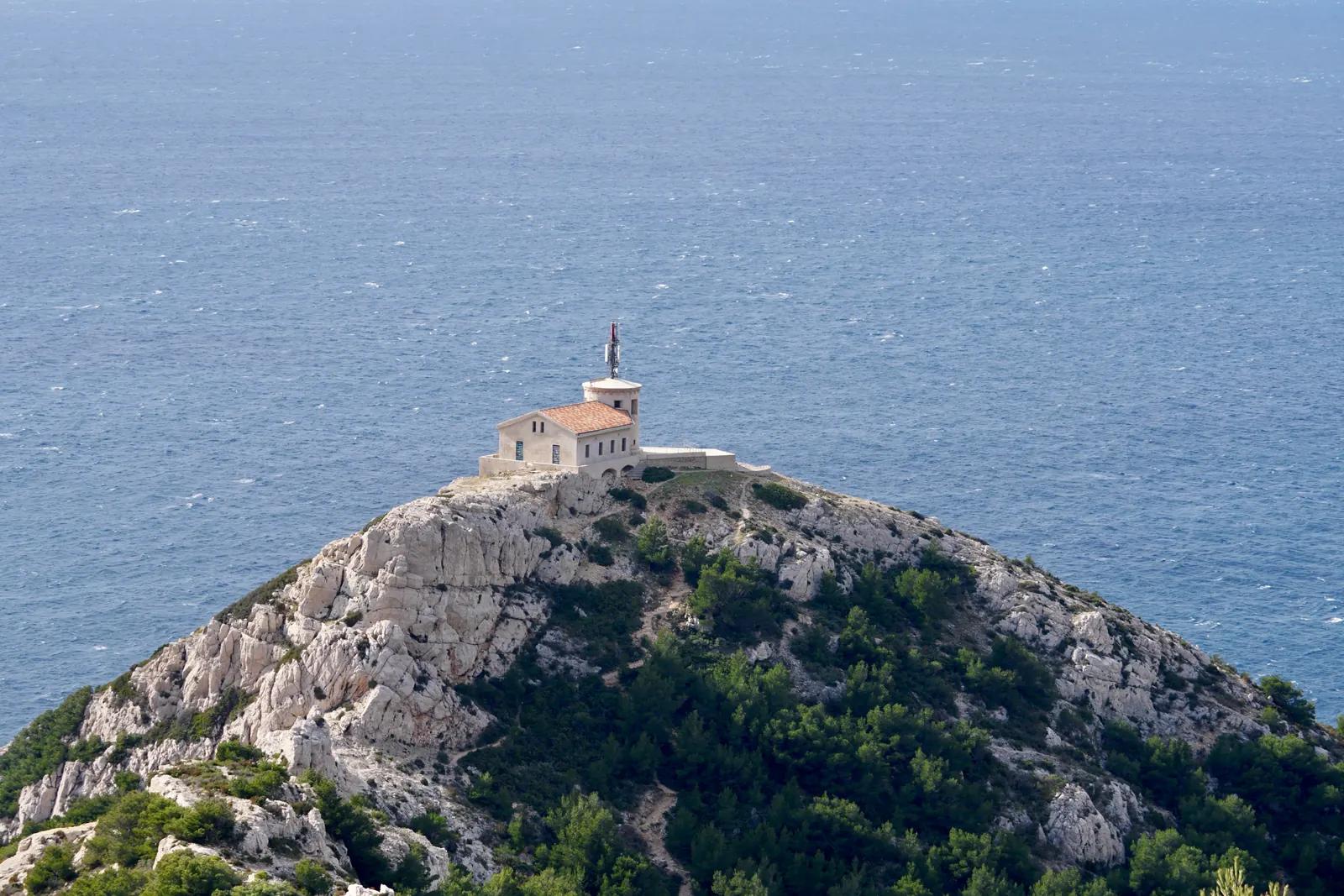 Rocky coast towards Les Goudes with a small tower on the cape